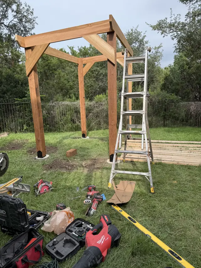 Pergola posts and beams going up during construction